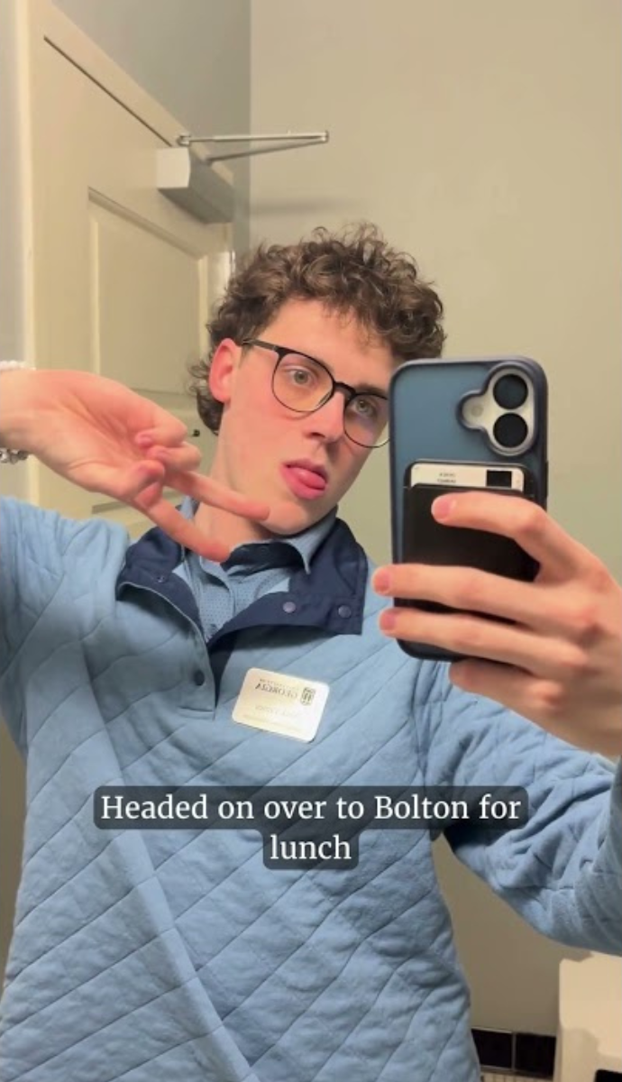 student taking mirror selfie