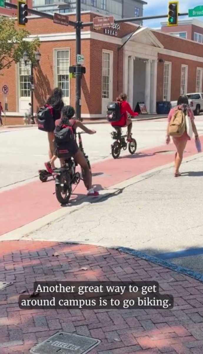 Students biking across the street